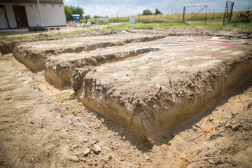 dug the foundations of the house by excavator, ready for building the house