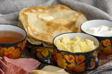 Breakfast in bed for your beloved, pancakes with sour cream, cheese and meat, corn porridge and a Cup of freshly brewed tea. Good morning!