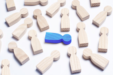Wooden figures of people on a white background. The concept of society, collective, company, family, neighbors. A crowd of people at a meeting, rally. Workers, employees, citizens. Kids toys. Close up