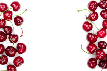 Sweet red cherries isolated on white background with copy space for your text. Top view. Flat lay pattern