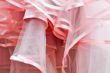 Wedding dress detail. Pink wedding dress frills close up.