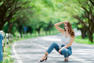 Portrait of sexy asian woman wearing long jeans,Fashion summer,Thailand people,Pose for take a photo,Lifestyle of modern woman