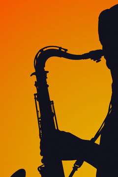 Silhouette of a saxophone player with hoodie..