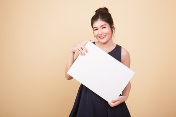 Young Asian woman with white blank sign.