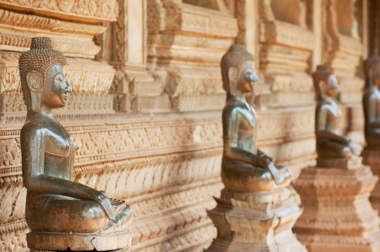 Ancient copper Buddha statues located outside of the Hor Phra Keo temple (former temple of the Emerald Buddha) in Vientiane, Laos.
