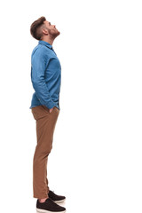 side view of relaxed casual man looking up