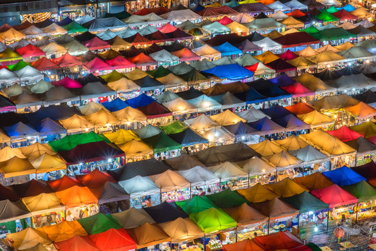 Aerial View,Bangkok Train Market Secondhand Market At Sunset Time. Bird Eyes View Of Multi-colored Tents /Sales Of Second-hand Market At Twilight - Panorama Picture  In Bangkok, Thailand