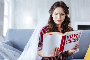 Surprising statistics. Beautiful future wife feeling rather surprised while reading some statistics...