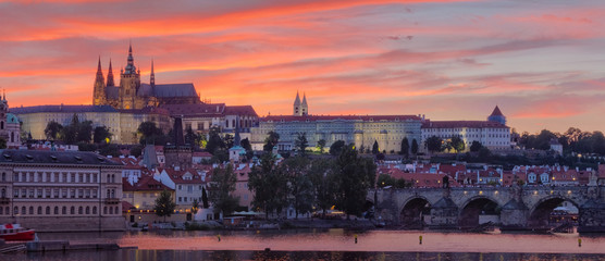 Beautiful sunset panorama view on Prague gothic Castle and Charles Bridge, Czech Republic