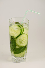 Fototapeta na wymiar Fresh detox water with cucumber, mint and basil. Fresh cucumber water.