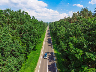 aerial view of straight highway. sunny day. car travel concept