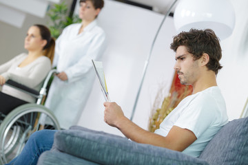doctors and patients in hospital waiting room