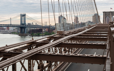 New York City / USA - JUN 20 2018: Brooklyn Bridge with Manhattan Bridge with buildings of DUMBO at early morning in New York City | JUN 20, 2018 | EDI CHEN