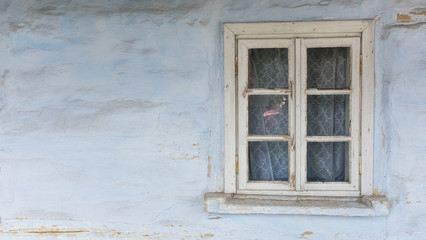 window and wall of an old wooden house