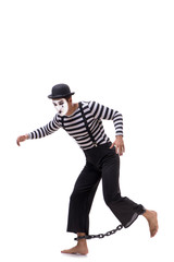 Mime with his feet chained isolated on white