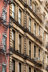 Fototapeta na wymiar New York City / USA - JUN 27 2018: Old colorful classic buildings, facade, architecture in Tribeca district, Manhattan