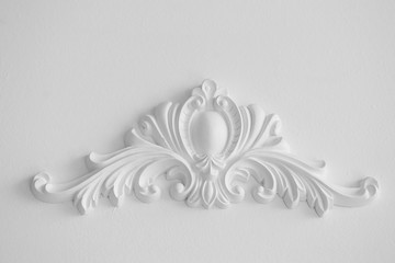 Stucco elements on white wall