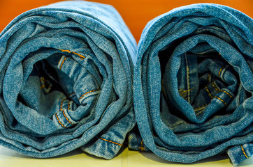 jeans on the background, blue jeans lie on a wooden background,