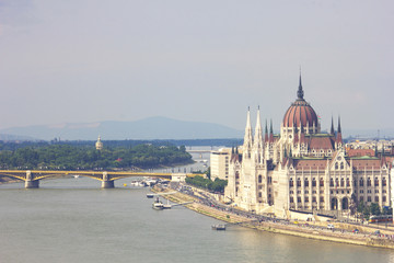 Fototapeta na wymiar Budapest, Hungary - June 2018, The Hungarian Parliament Building, the Orszaghaz, and the River Danube in Budapest, Hungary, 29 June 2018