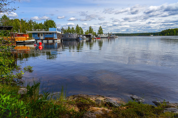 Fototapeta premium Small boats moored on Saimaa lake.Imatra town.