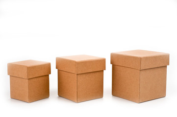 Three square boxes of eco-friendly cardboard on white background