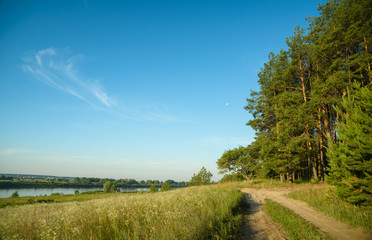 a picturesque view, a road along the river