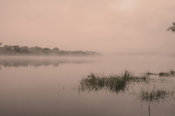Morning on a river with fog, fishing, vintage view