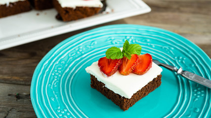 brownies with strawberry on a plate
