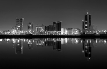 Fototapeta na wymiar Bahrain skyline during night with dramatic reflection