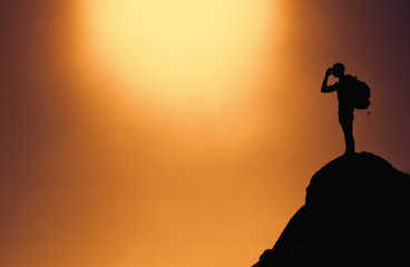 Silhouette of a climber on summit with copy space as symbol for success