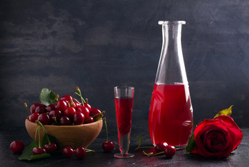 Homemade cherry alcohol drink liquor with fresh cherry berries. horizontal, room for text