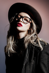 lady with glasses and hat