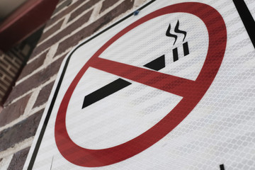 No Smoking Sign On A Brick Wall