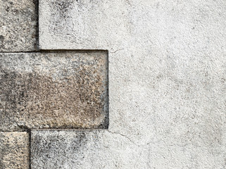 Textured rugged white and grey surface of a wall