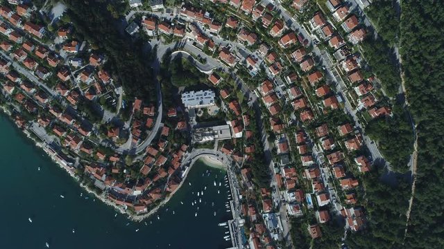 Overhead aerial view of expensive villas in popular neighborhood in coastal town of Rabac in Croatia, Adriatic shoreline in Europe