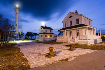 Early morning skies behind an old lighthouse in a park
