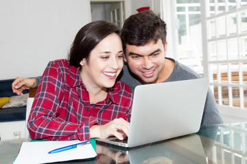 Young couple in love using computer