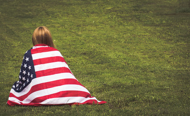 Young woman with american flag 4th of july
