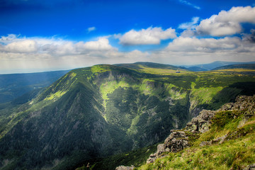 Fototapeta premium The highest mountain Snezka in national park Krkonose in Czech republic. There is beautiful view and scenery. The hill is in the clouds. 