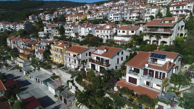 Slow drone flight over large homes in residential neighborhood in Rabac, Croatia