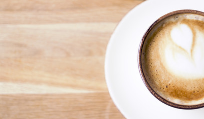 Girl having a break with cup of coffee, close up, soft focus, vintage filter.