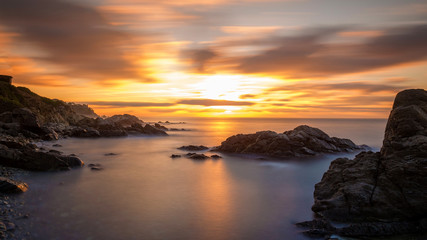 Fototapeta na wymiar Beautiful sunrise in a bay in Costa Brava, Spain
