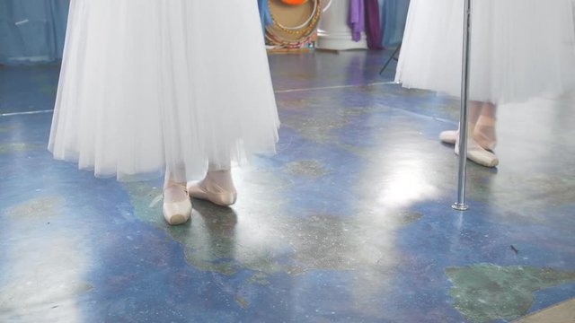 Ballet dance in studio - shoes on wooman's feet