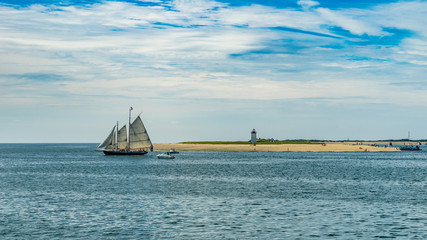 Obraz premium wo-masted yacht and Beautiful landscape of ocean beach Cape cod Massachusetts