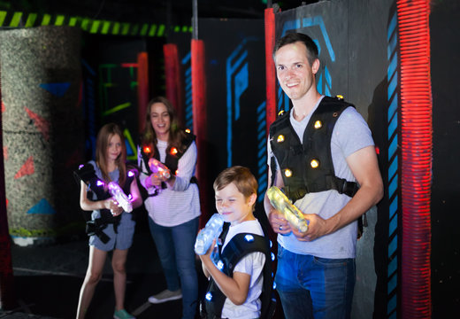 Father and son playing laser tag