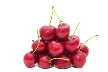 ripe red cherries isolated in white background