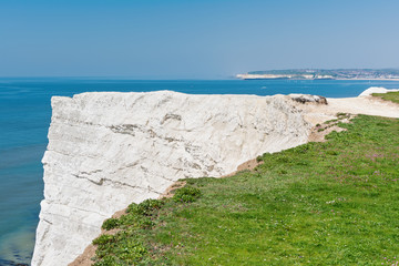 Seaford Head, East Sussex, England. View of the white chalk cliffs to the west in the morning, part of Seven Sisters National park, selective focus