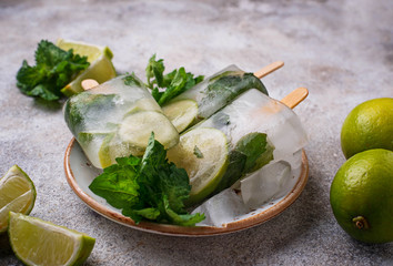 Mojito cocktail popsicle with mint, lime and rum 