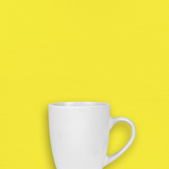 White mug on yellow background