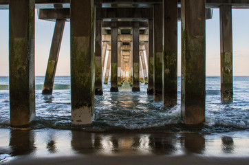 A view of the ocean from beneath Jennette's pier in Nag's Head of the Outer Banks in North Carolina
